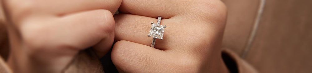 A woman wearing her new moissanite engagement ring.